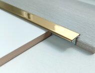 Т-профиль из нержавеющей стали 15 мм ТА-15 золото шлифованное 2,7 м Т-профиль из нержавеющей стали 15 мм ТА-15 золото шлифованное 2,7 м